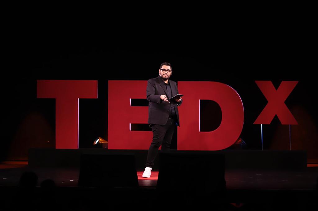 Dr. Carlos Merlo on the TEDx stage